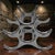 The Eichholtz Alboran Attributed Polished Aluminum 6 Bottle Modern Wine Rack is a sleek and stylish addition to any...