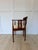 Elegant vintage Chippendale-style accent chair featuring a classic tub chair silhouette, intricate inlaid mahogany...