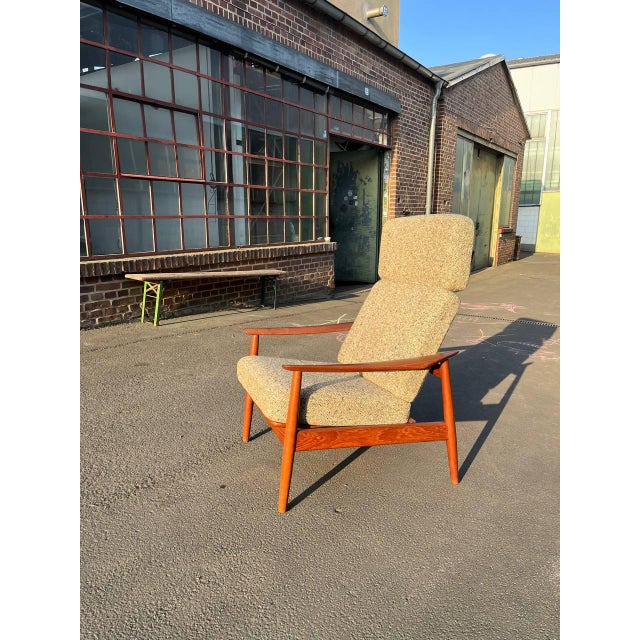 The FD164 consists of a solid teak frame, and the cushions are upholstered in beige "Salt and Pepper" wool fabric (both...