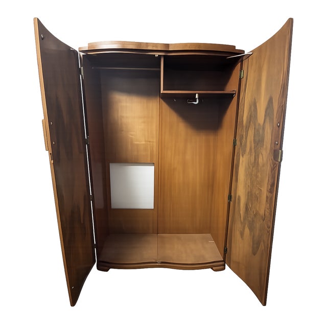 Elegant Art Deco Revival armoire featuring a dramatic bowed front with burled walnut veneer doors and solid walnut sides....