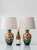 Hand-painted in oxblood red and yellow blooms on an ivory ground, with passages of orange, teal, and black all outlined in...