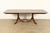 A beautiful Georgian or Regency style double pedestal extension dining table By Drexel USA, Circa 1950s Beautiful...