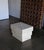 Sculptural modernist travertine side table or pedestal circa 1980.