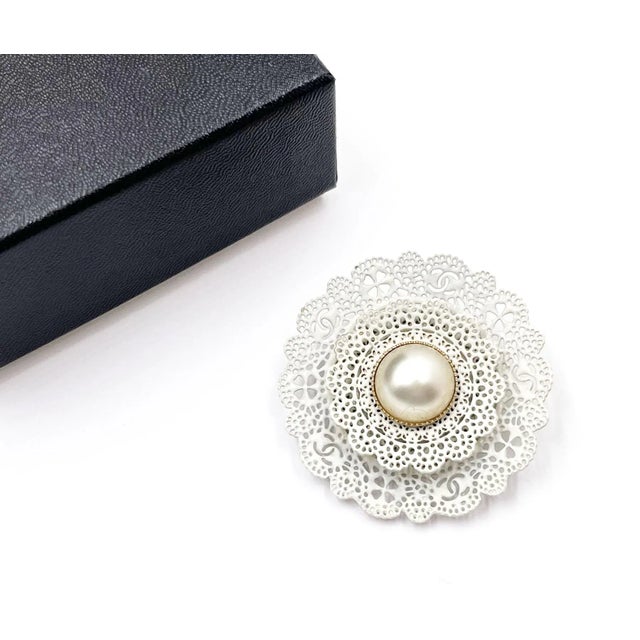 This is part of Chairish’s Costume Jewelry assortment. Chanel Pearl CC White Lace Brooch * Marked 15 *Made in Italy *Comes...
