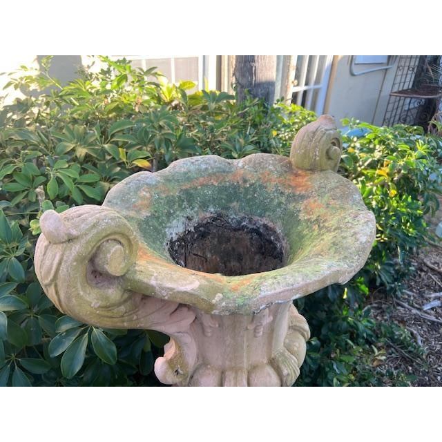 This product is a pair of large stone garden urns standing at 52 inches tall, each adorned with a pedestal. The urns...