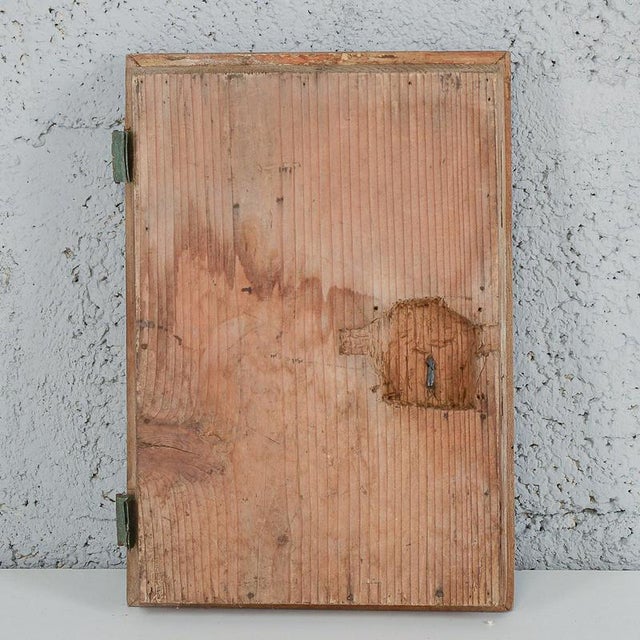 This small, solid wood antique door is an attractive piece of antique furniture, ideal for lovers of historic pieces and...