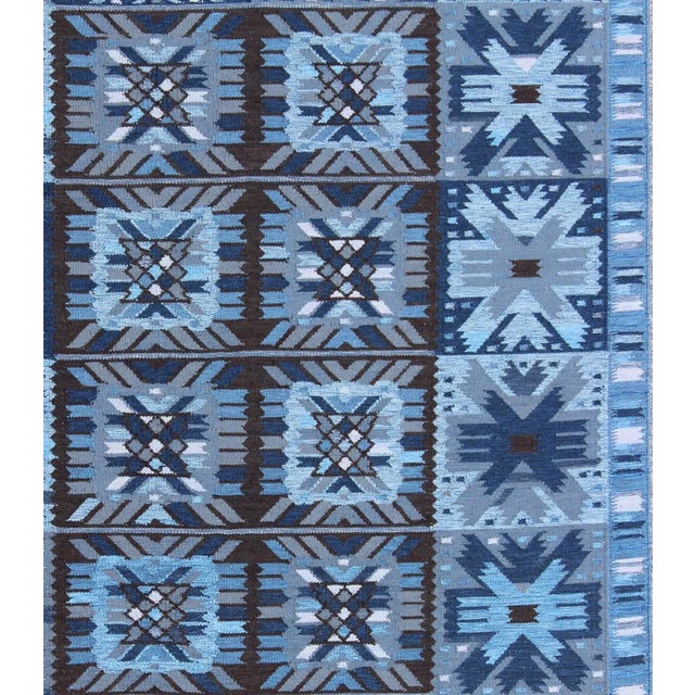 Measures: 9' x 12'. Keivan Woven Arts Contemporary Scandinavian Flat-Weave Swedish Design Rug in Blue & Brown Colors....
