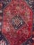Nice mid-20th century little colored rug with beautiful tribal design and red field color, entirely hand knotted with wool...