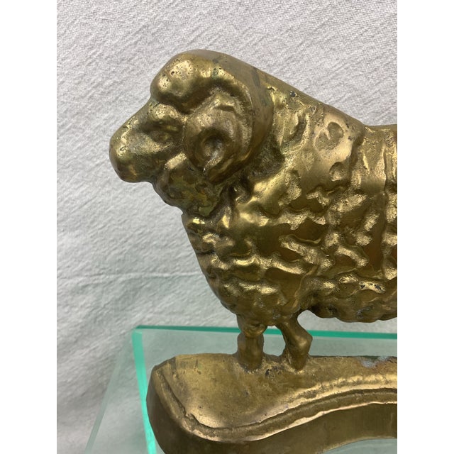 These antique doorstops were usually English or Scottish.. This guy is solid brass and most seem to be iron. His anatomy...