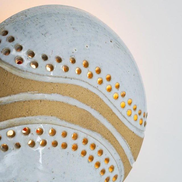 Spectacular circular ceramic wall light, with beautiful accents. Manufactured in denmark in the 1970s. In the style of...