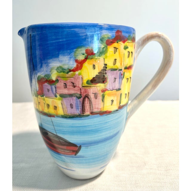 A beautifully hand-painted Italian ceramic pitcher from Vietri's sought-after La Fenice collection. Featuring a rcharming...