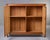 Two-door cabinet featuring striking checkerboard parquetry veneer across the front doors. Distinguished by ornate brass...