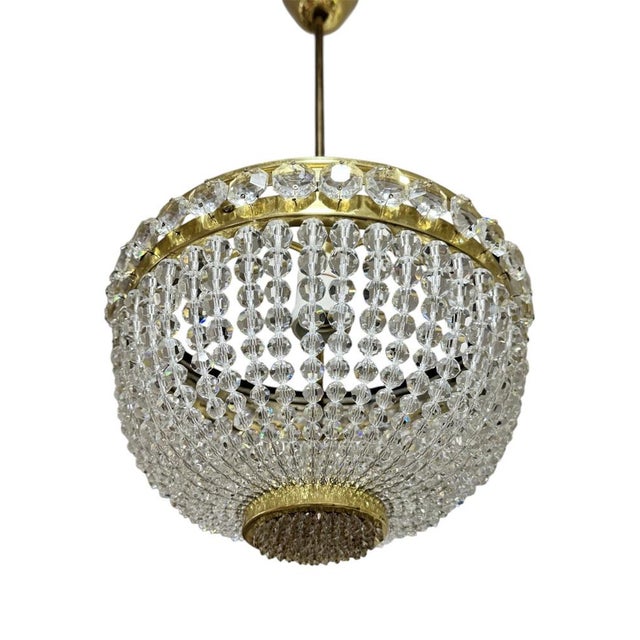 Mid-century French Empire style crystal chandelier, Bohemia circa 1950. Basket shape dome adorned with rows of faceted...
