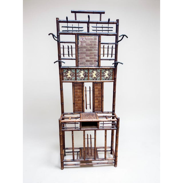 A wonderful late Victorian to early Edwardian bamboo hall stand, full of character and decorative interest. The central...