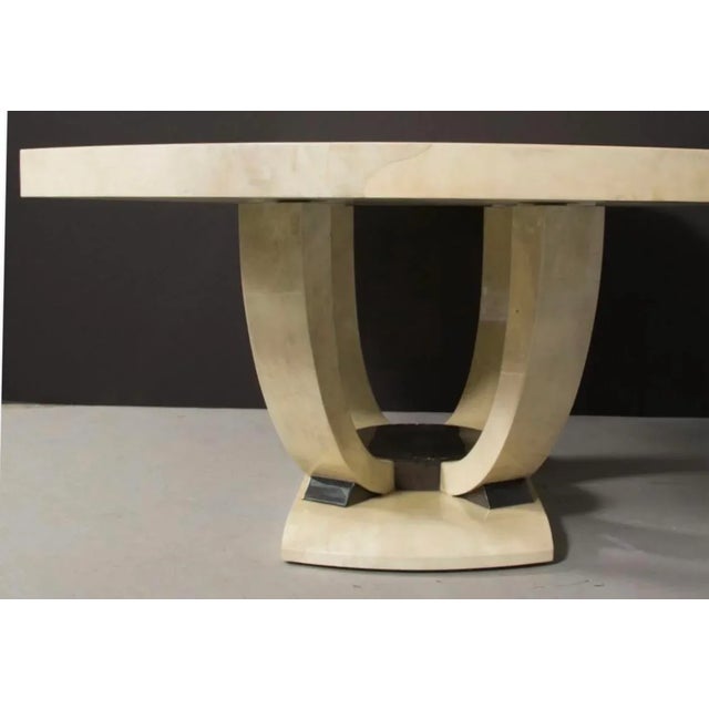 Unique Art Deco style table, fully covered in goatskin in two colours. The base with lyre-shaped legs, very similar to the...