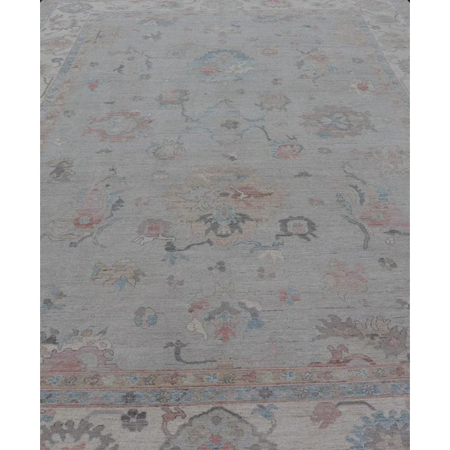 Large Oushak Rug with Floral Motifs & Muted Colorful Tones on Neutral Background and Silver Gray. Keivan Woven Arts; rug...