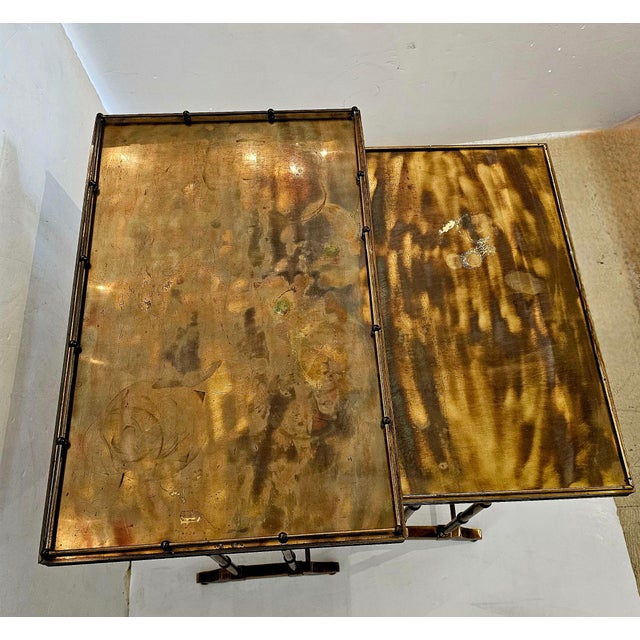 Two stunning nesting tables having faux bamboo bases and marbleized metal iridescent surfaces. Smaller table is 22 h 15 d...
