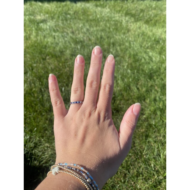 Stones: diamonds, 5 stones princess cut 1.8 mm approximately .15ctw F-G color, VS1-2 clarity sapphires, 6 stones princess...