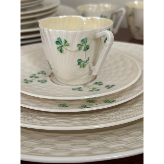 Vintage Belleek Irish porcelain 20-piece dinnerware service for four, featuring the classic Basketweave Shamrock pattern...