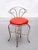 Vintage boudoir, vanity chair of brass, circa 1950, handcrafted with brass round wire with a fixed upholstered seat in red...