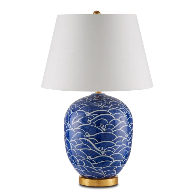 Though its surface is swirling with a motif that was born in an ancient culture, the Nami Table Lamp is just as at home in...