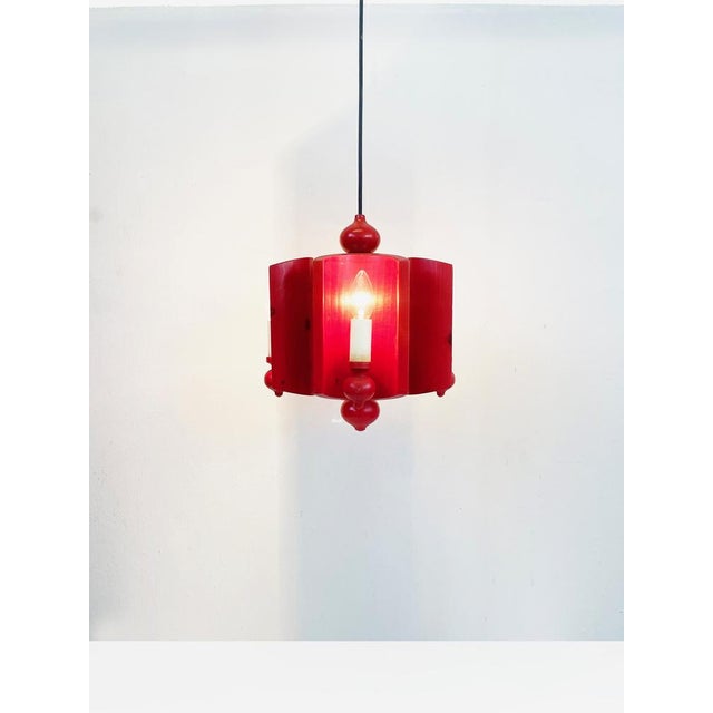 Modern Scandinavian simplicity makes this chandelier — finished in a bright red — a true and rare delight. with 4 candle-...