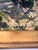 This oil painting by M. Jacobs captures a sweeping hillside view bathed in natural light. The artist’s impressionistic...