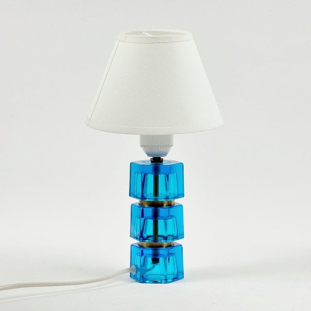 Stunning glass & brass bedside/table lamp by carl fagerlund for orrefors (sweden, 1960s). Three thick blue glass elements...