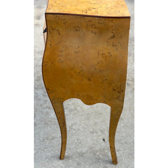 This beautiful Italian olive wood commode boasts excellent craftsmanship. With two drawers, it is smaller in scale than...