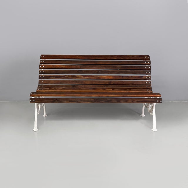 Italian Art Deco wooden and white cast iron bench, 1930s Outdoor bench with seat and backrest made of wooden slats. The...