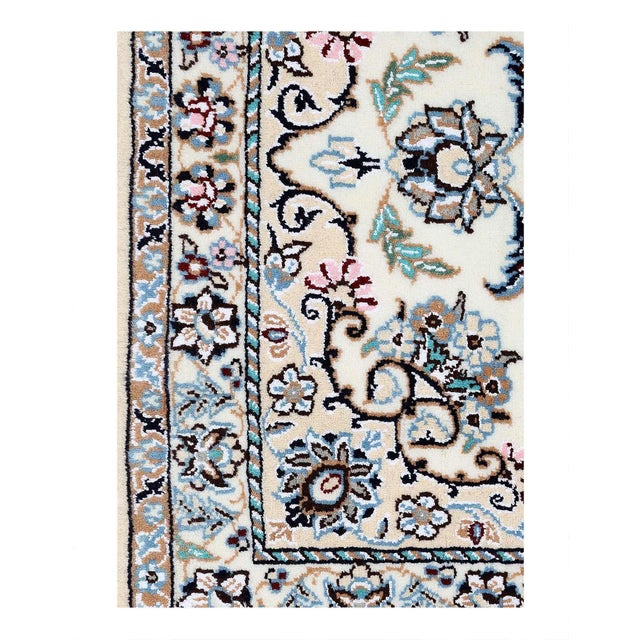 Persian Nain rugs are renowned for their detail and fine use of outlining along the central motifs. Breaking from the...