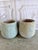 Pair of monumental terra cotta garden urns, circa 1970-1990. Classic architectural "soufflé" urn form with soft...
