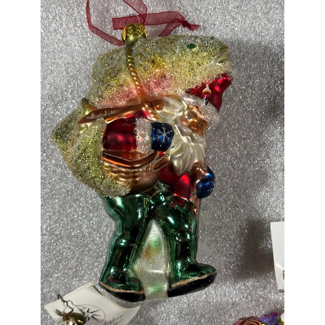 A set of 20 hand blown, hand painted glass Christmas ornaments. Includes a collection of teddy bear ornaments with an...