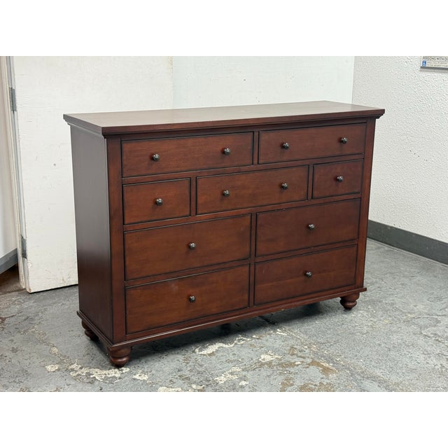 Design Plus Gallery presents a Cambridge Chesser from Aspenhome. Finished in brown cherry with hardwood solids and birch...