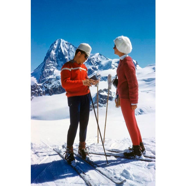 Skiing the Haute Route by Toni Frissell Two Skiers pause on their journey through the infamous “Haute Route”, Switzerland,...