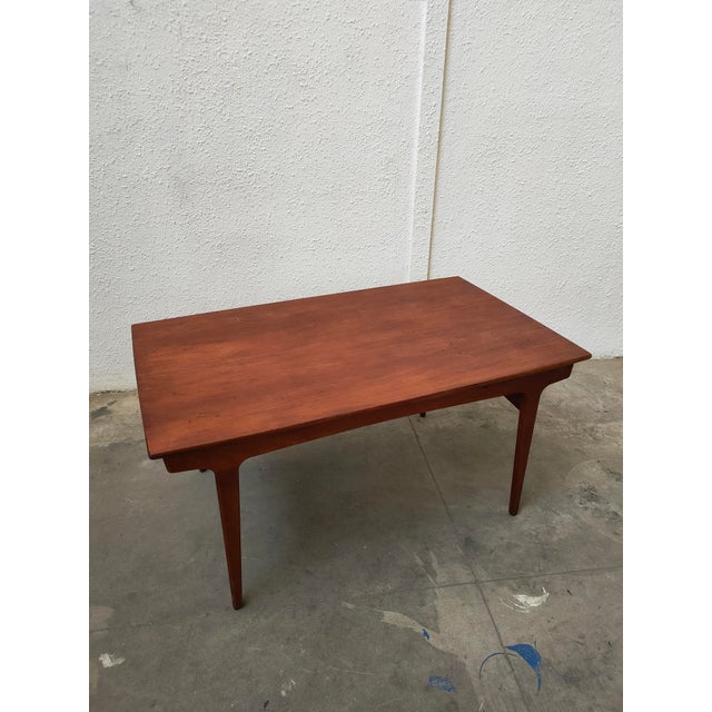 : Elegant extendable dining table, made of teak wood, 1970s. – Sturdy legs for greater stability. – Smooth and spacious...