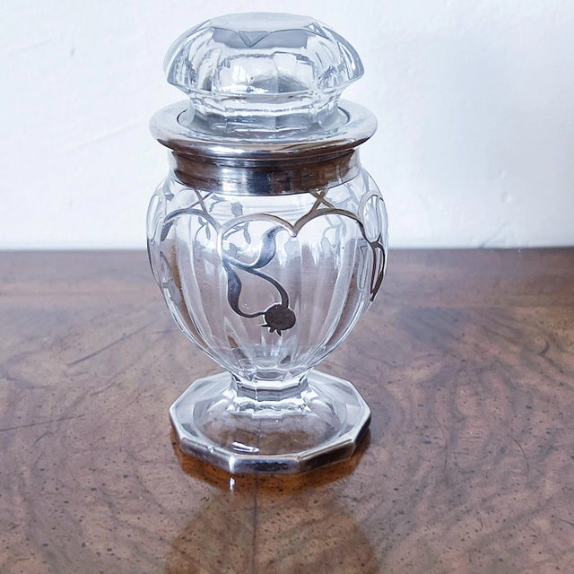 Vintage Art Nouveau Lidded Glass Jar with Applied Silver Filigree Scrollwork The perfume bottle has a scroll or vine...