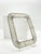 A rare tabletop photographic frame by Mathieu Matégot, a major figure in post-war French design, crafted from perforated...