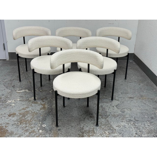Design Plus Gallery presents a Set of Six Inesse Dining Chairs by Omar De Biaggio for Cb2. These ivory boucle dining...