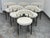 Design Plus Gallery presents a Set of Six Inesse Dining Chairs by Omar De Biaggio for Cb2. These ivory boucle dining...