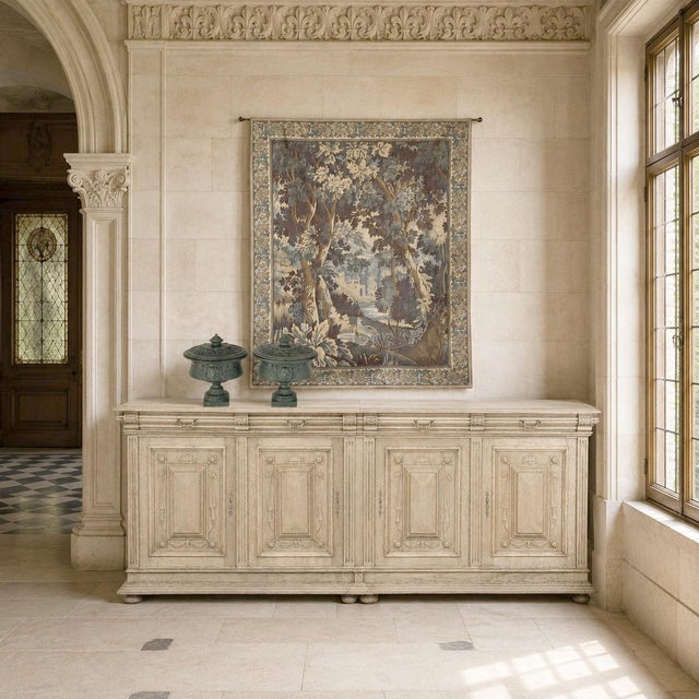 Antique Flemish Verdure Tapestry with Original Decorative Border was woven in the enduring verdure tradition associated...
