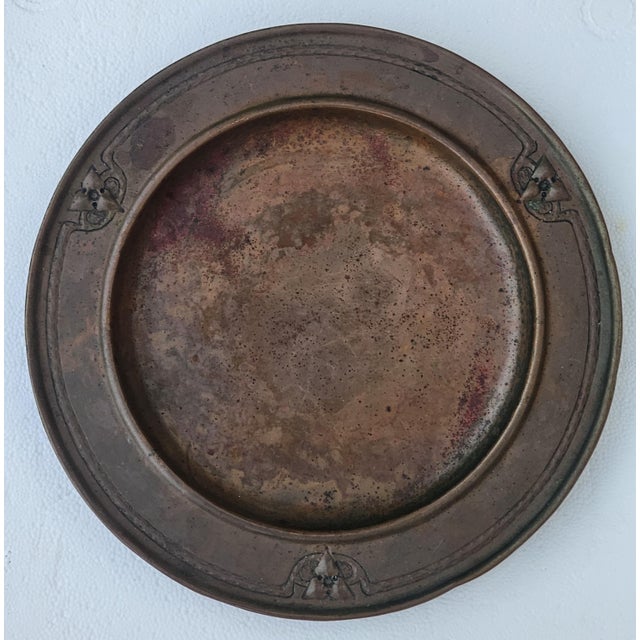 A beautifully hand‑wrought Arts & Crafts copper charger by Roycroft, the influential American craft community founded by...