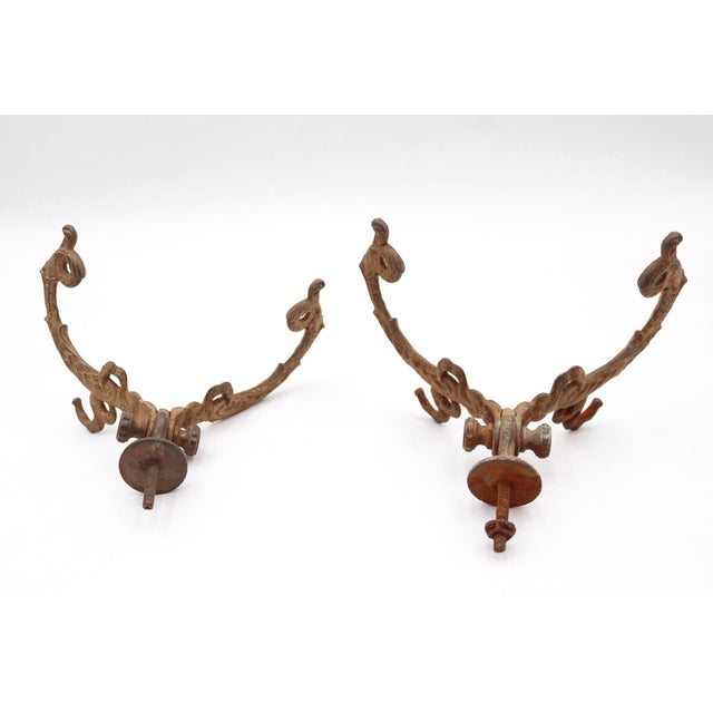 Victorian style hall tree hooks made of cast iron with a distressed painted tan finish. One is missing the original...