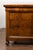 A pair of Italian 18th century walnut commodes with bookmatched veneer, four drawers and petite carved feet. Immerse...