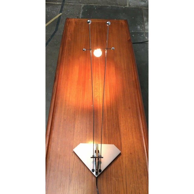 Filigree low-voltage halogen table lamp. A very technical design. Reduced to the bare essentials. The inclination of the...