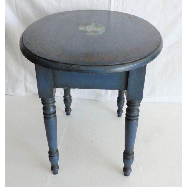 19th century blue painted small oval table with original decoration of a New England scene in the center of the tabletop....