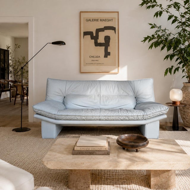 A beautifully sculptural vintage Italian leather loveseat by Nicoletti Salotti, showcasing the relaxed oversized...