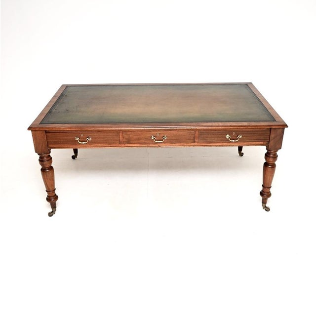 A superb antique Victorian solid walnut library table / desk. This was made in England, it dates from around the 1860-1880...