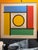 Large square geometric painting by famed French artist Patrice Bertin. White background with geometric patterns in red,...
