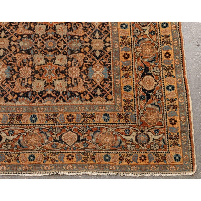 Persian Veramin Wool Rug, Northwest Persia, first quarter 20th century, with repeating floral design on a blue ground. 5'...